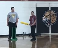 Trying to swing the bat to strike the ball